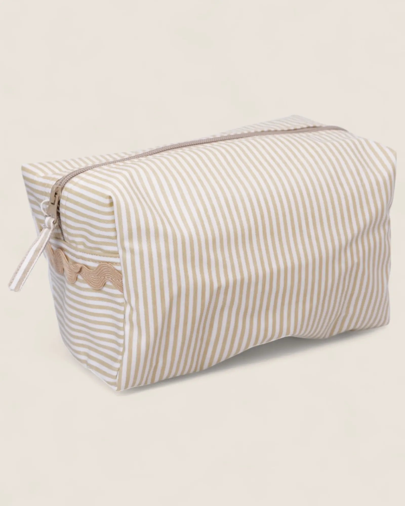 Striped toiletry bag with a beige zipper