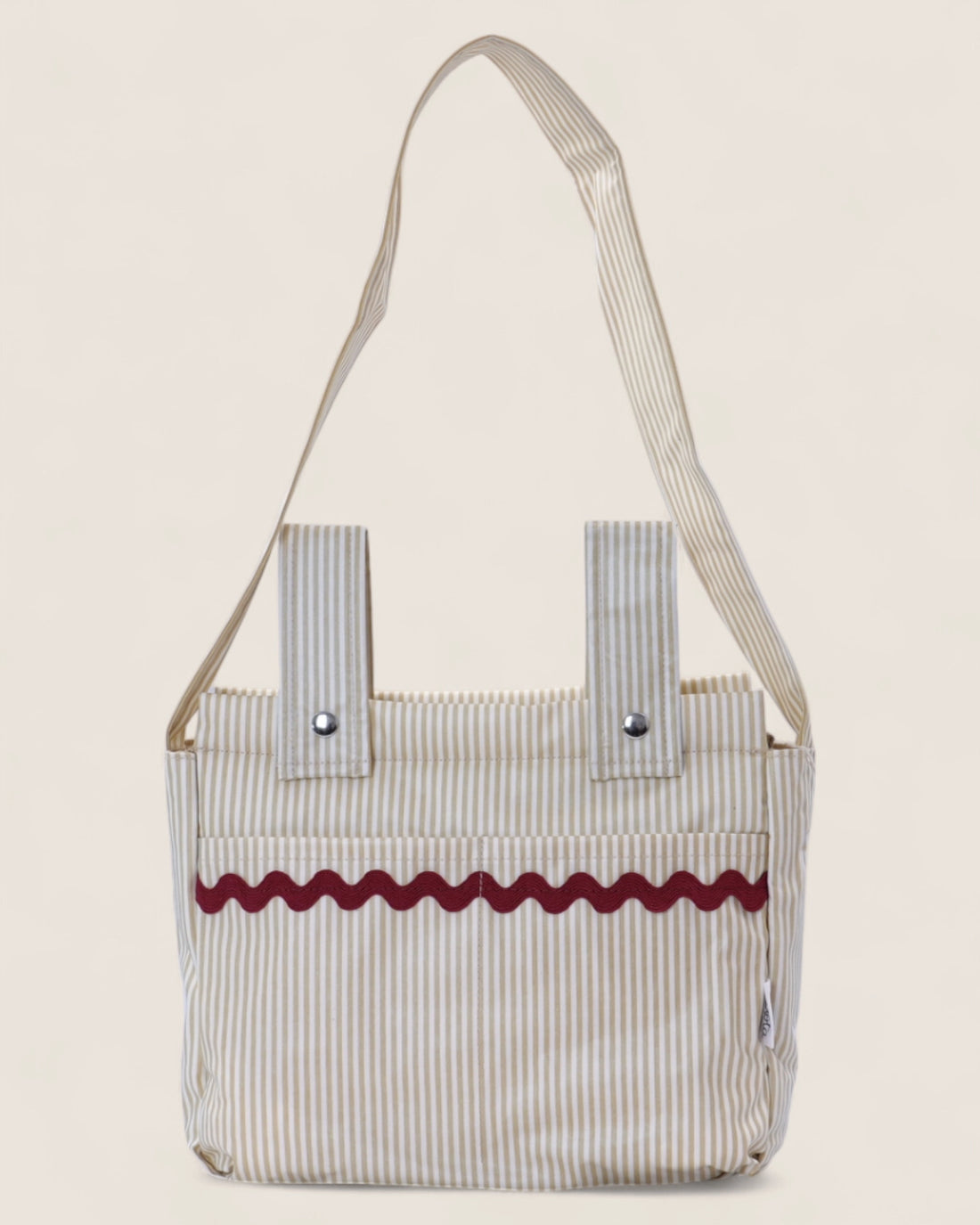 Striped baby stroller bag with a red decorative waved strip