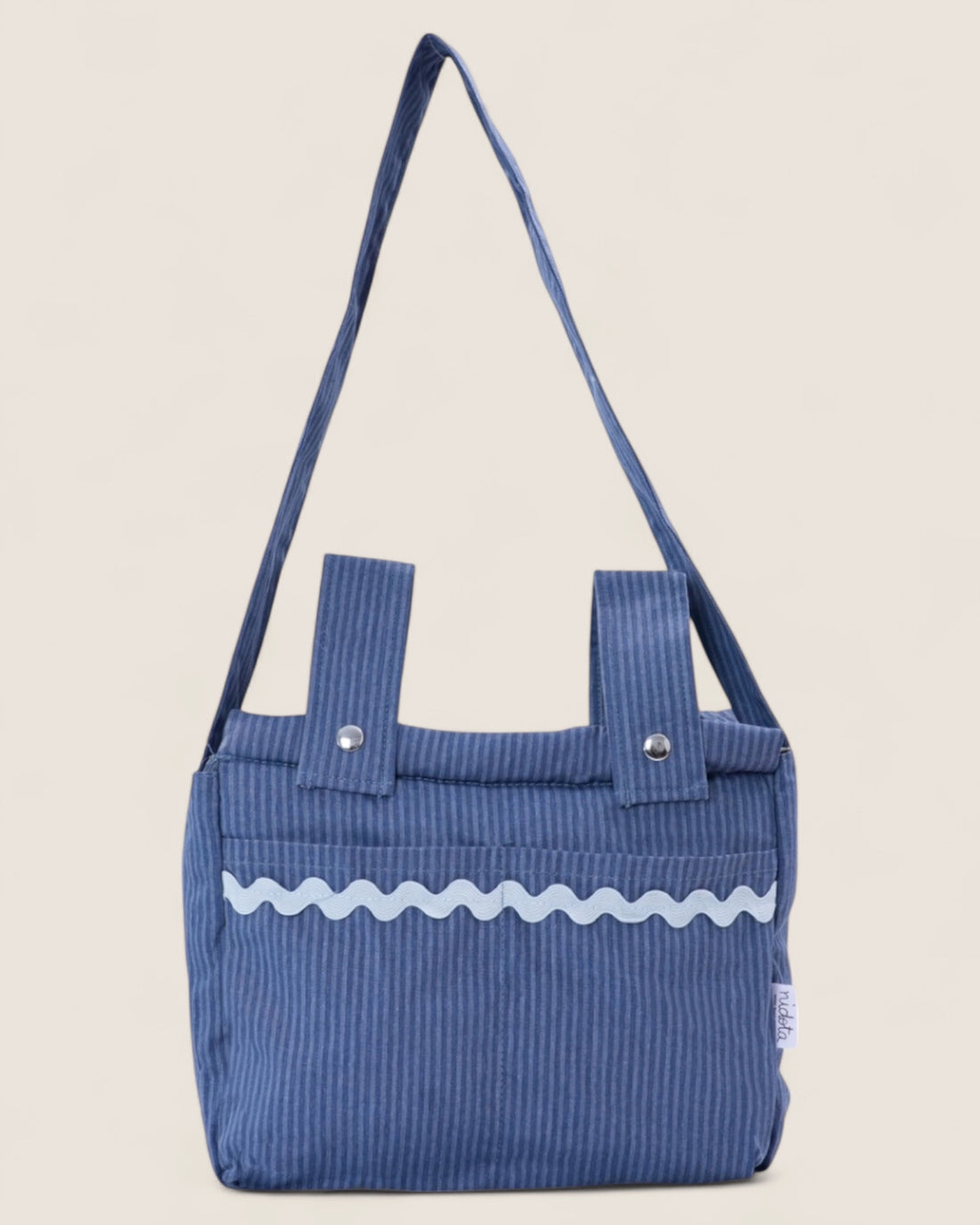 striped blue baby stroller bag with light blue waved detail and handles 