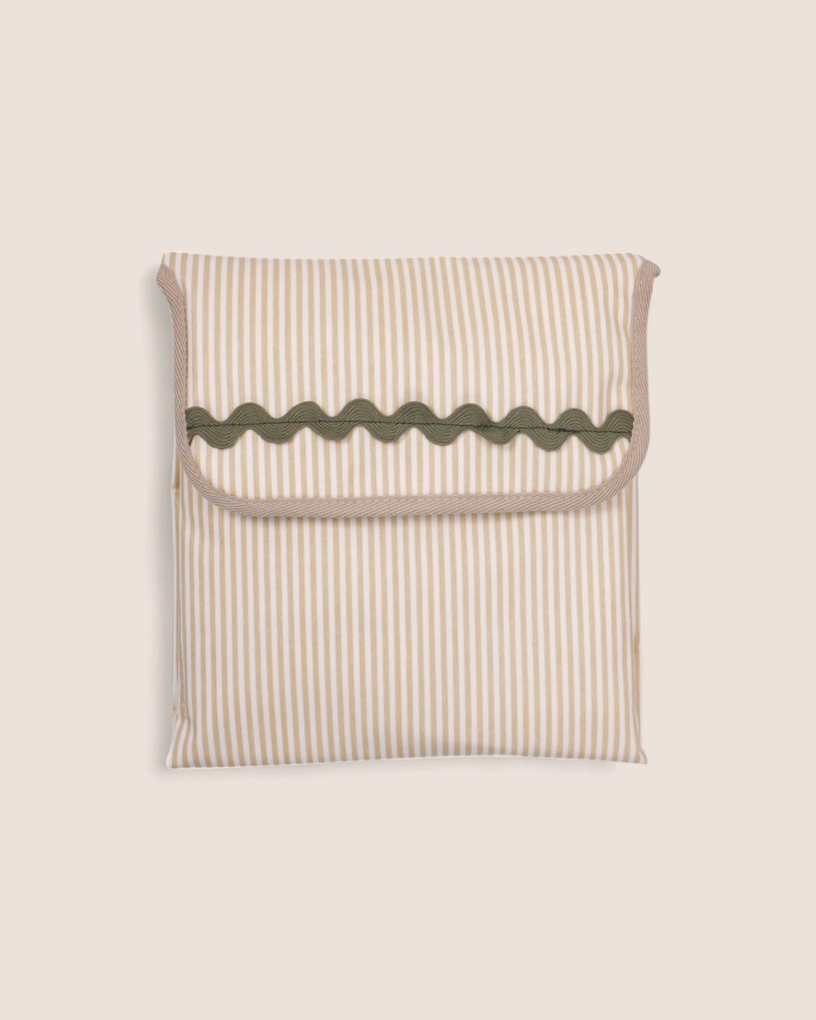 folded baby changing mat striped beige with green waved detail