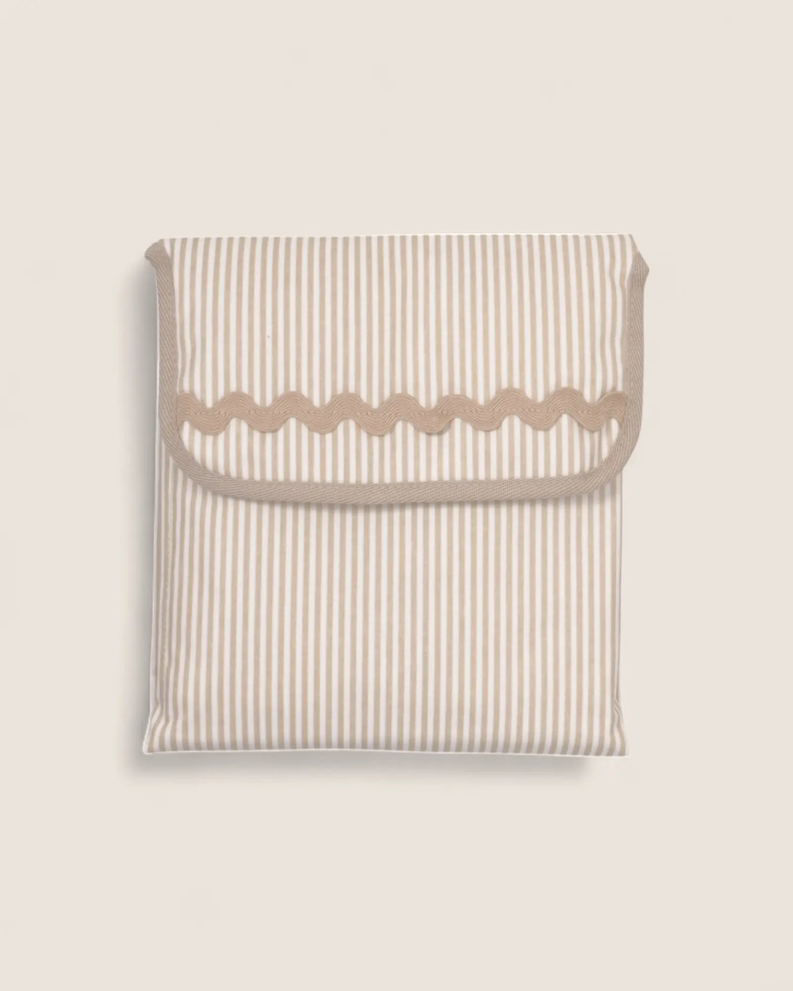 baby changing mat folded, beige stripes and beige waved detail