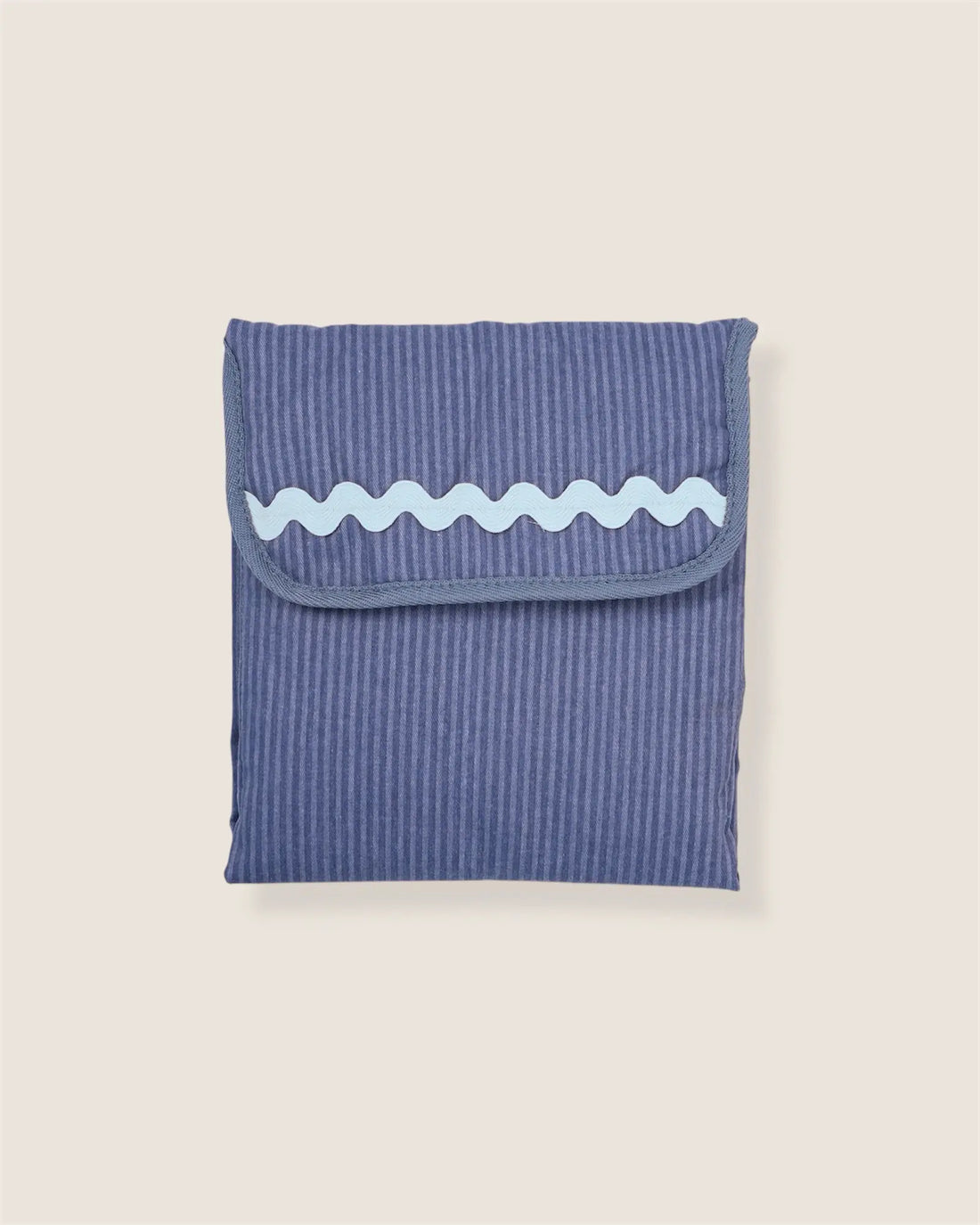 folded blue striped baby changing mat with light blue waved detail