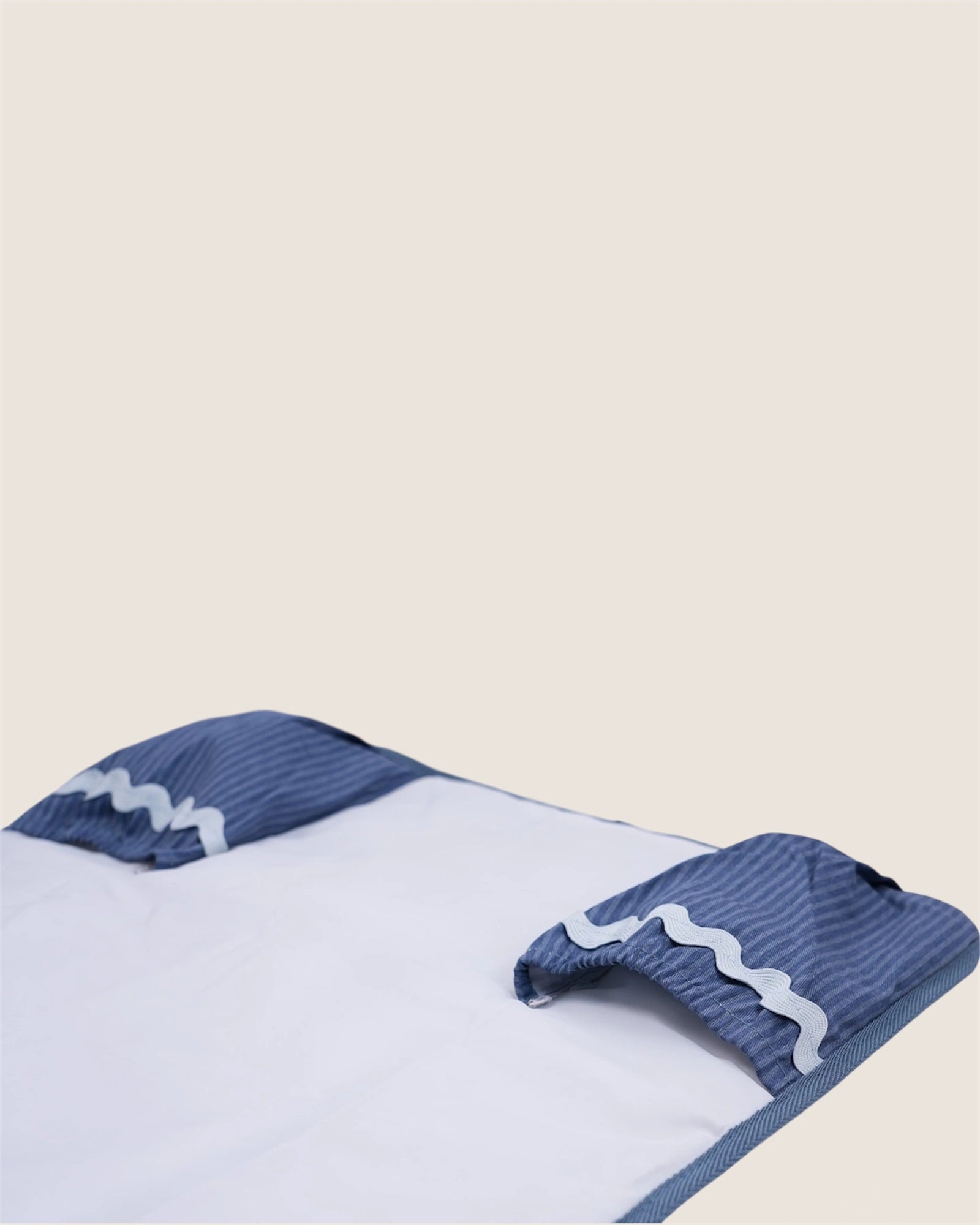 baby changing mat with blue pockets for wipes and diapers
