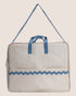 striped beige maternity bag with blue handles and details