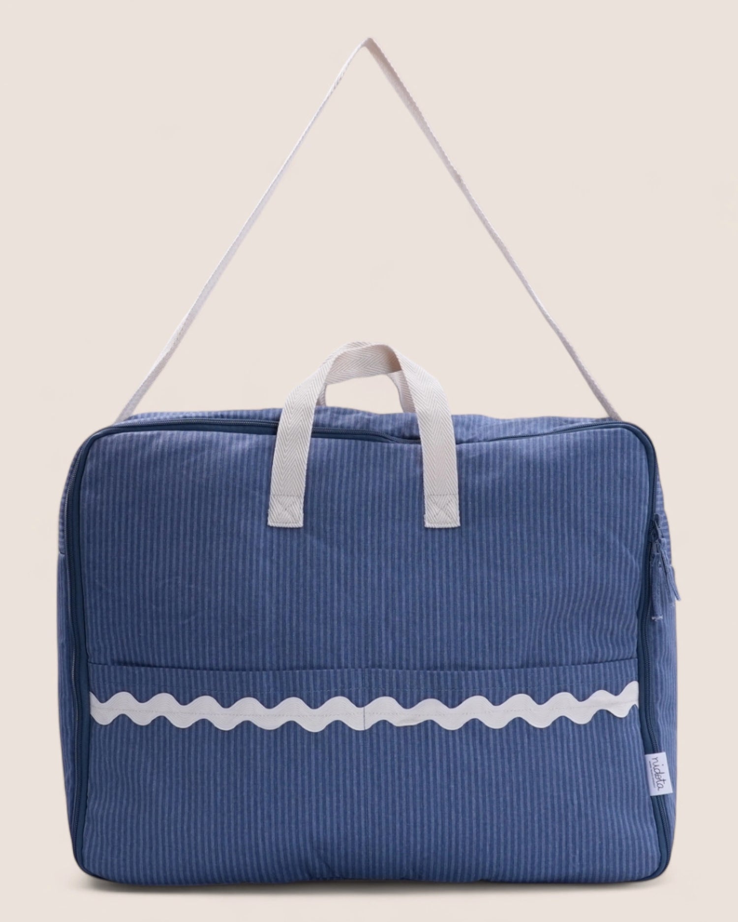 Blue maternity suitcase striped bag with white handle and decorative waved stripe 