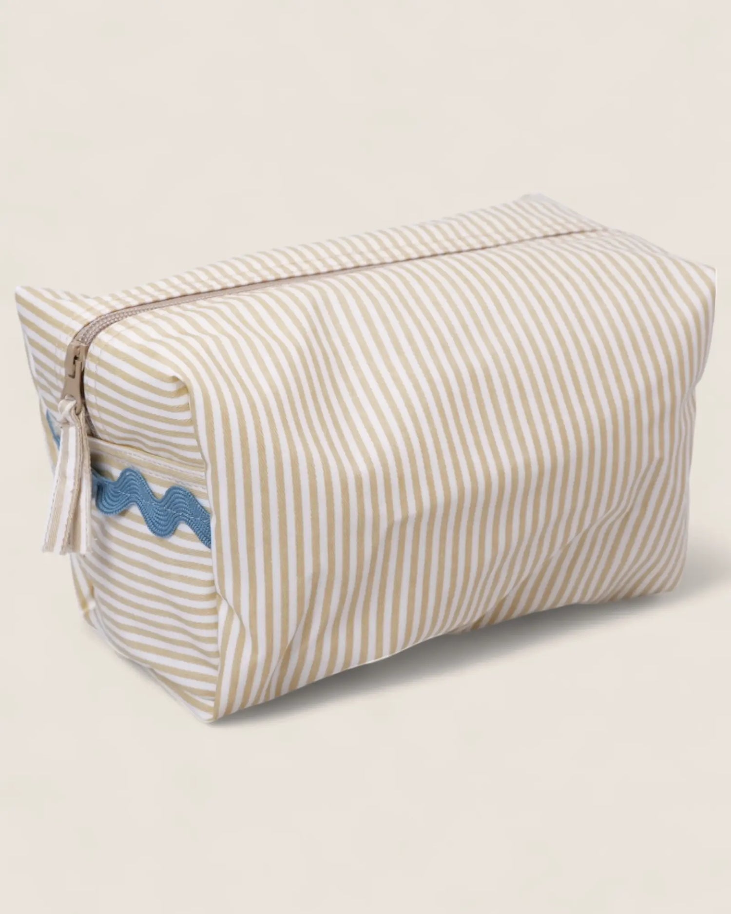 Rectangular striped toiletry bag with blue waved detail 