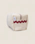 Striped beige toiletry bag with a red wavy design 