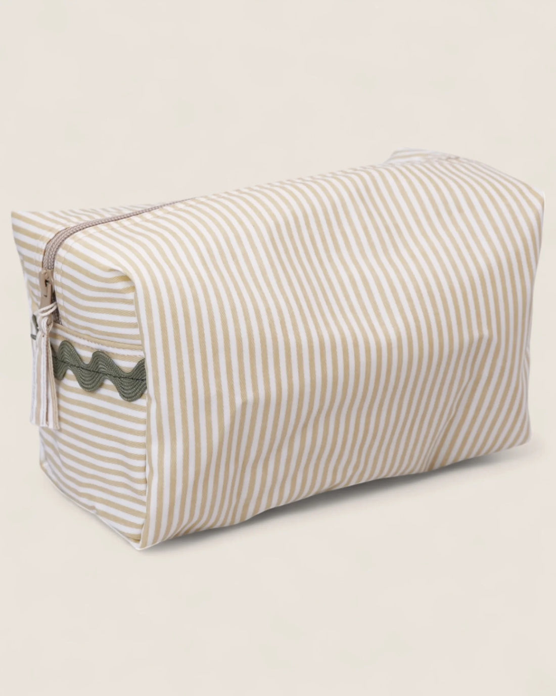 striped beige toiletry bag with a zipper and green details 