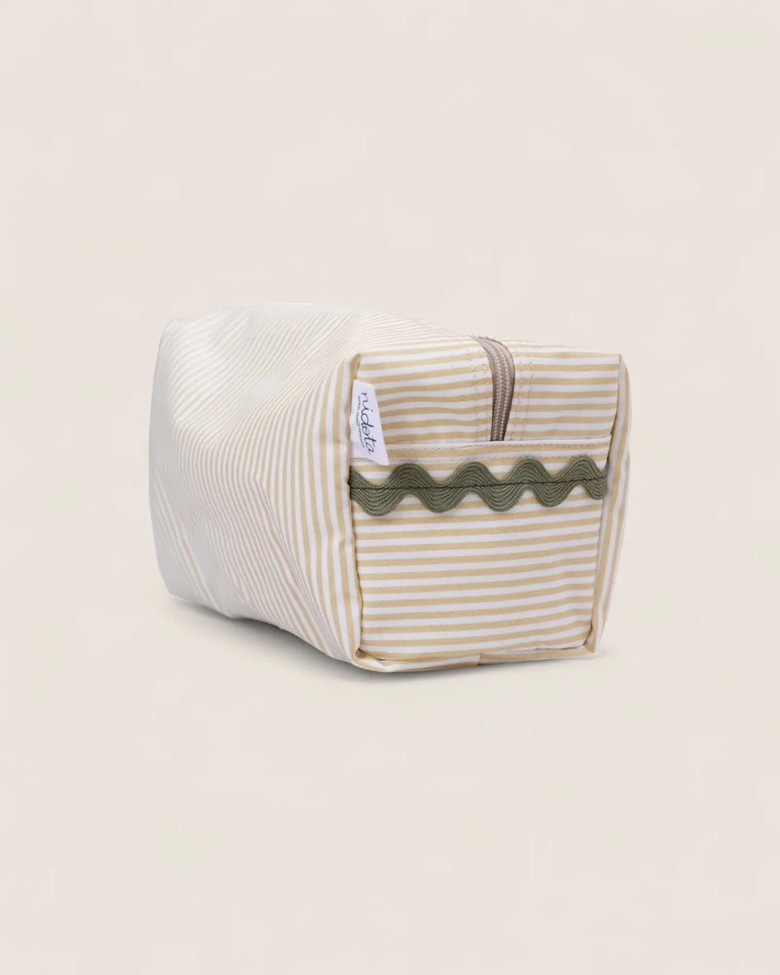 striped beige toiletry bag with green waved detail 