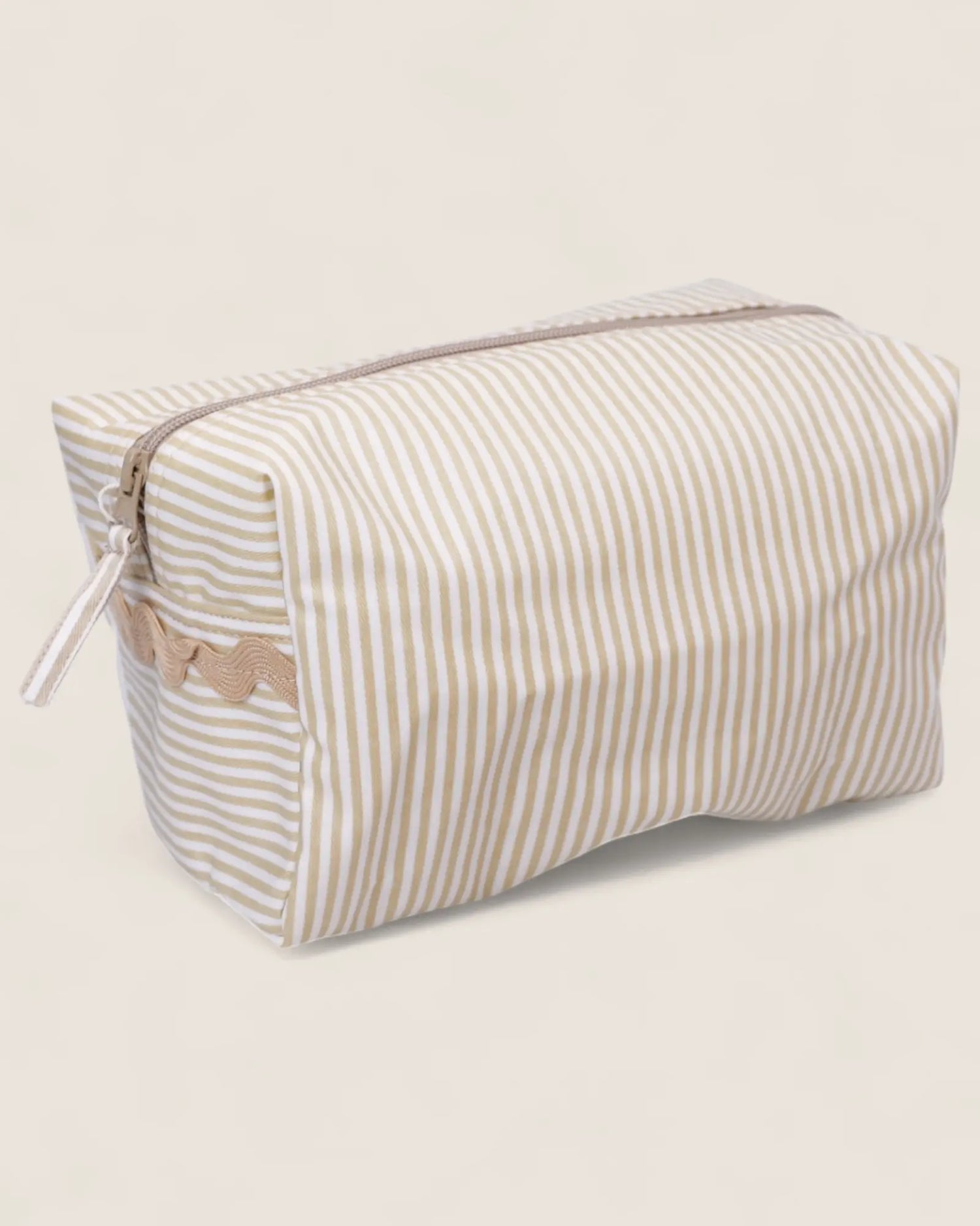 Striped toiletry bag with a beige zipper 