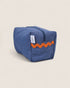 Blue striped toiletry bag with orange waved design on a beige background