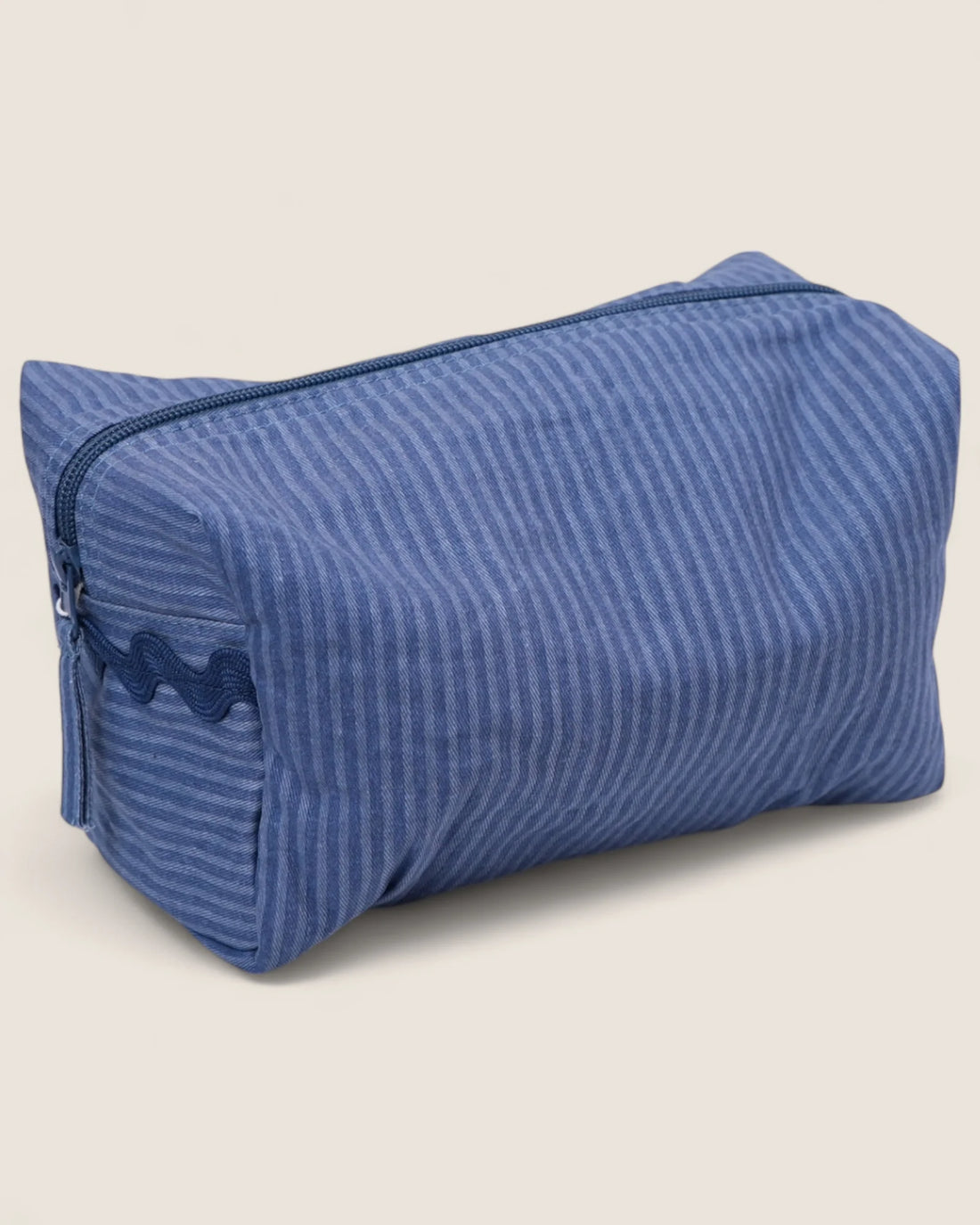 blue striped toiletry bag with blue zipper