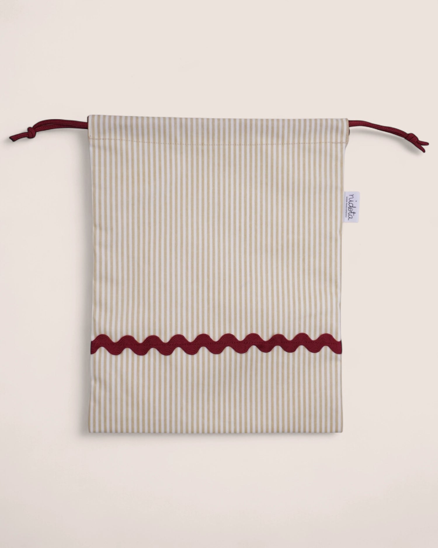 pouch bag with striped beige pattern and red waved details