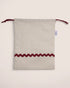 pouch bag with striped beige pattern and red waved details