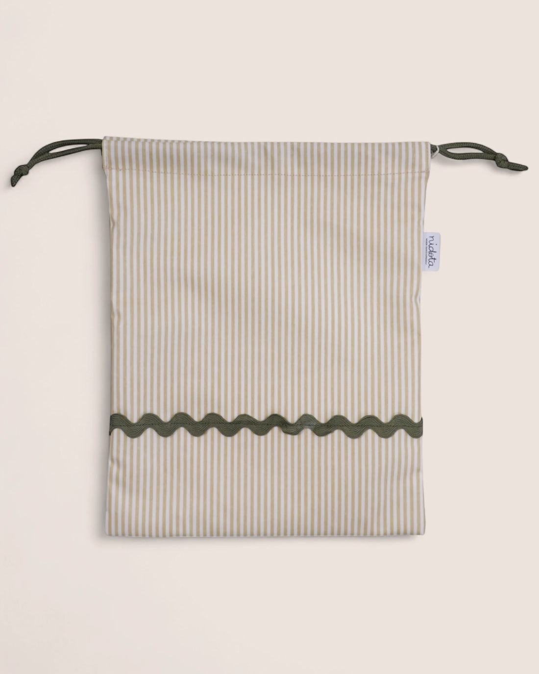 pouch bag with striped pattern and green details on a beige background