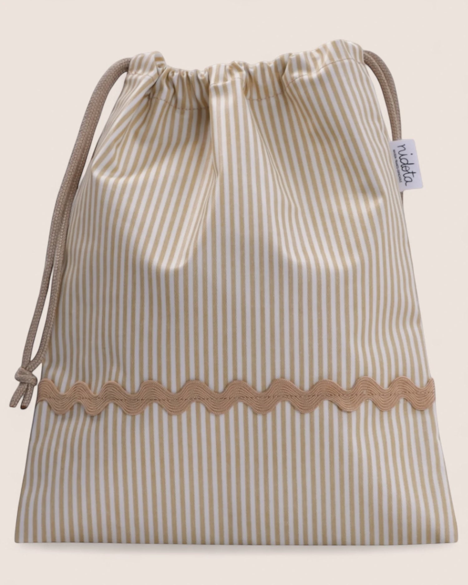 striped beige pouch bag with beige waved detail