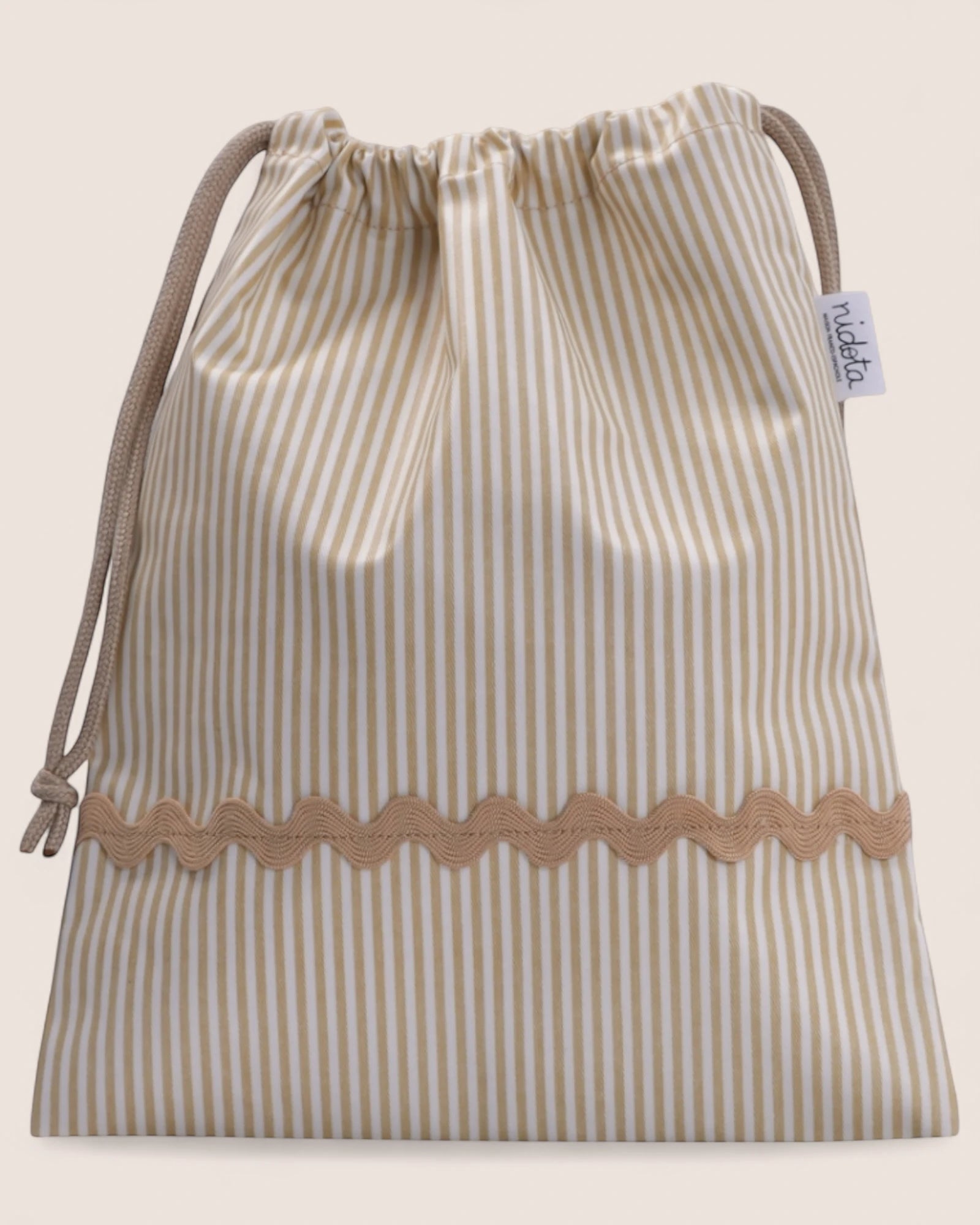 striped beige pouch bag with beige waved detail
