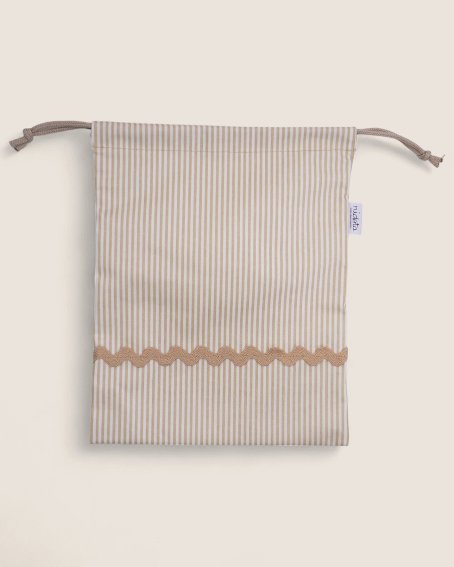 Striped pouch bag with wavy bottom edge on a light beige background