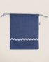 Blue striped pouch bag with light blue wavy line on a beige background