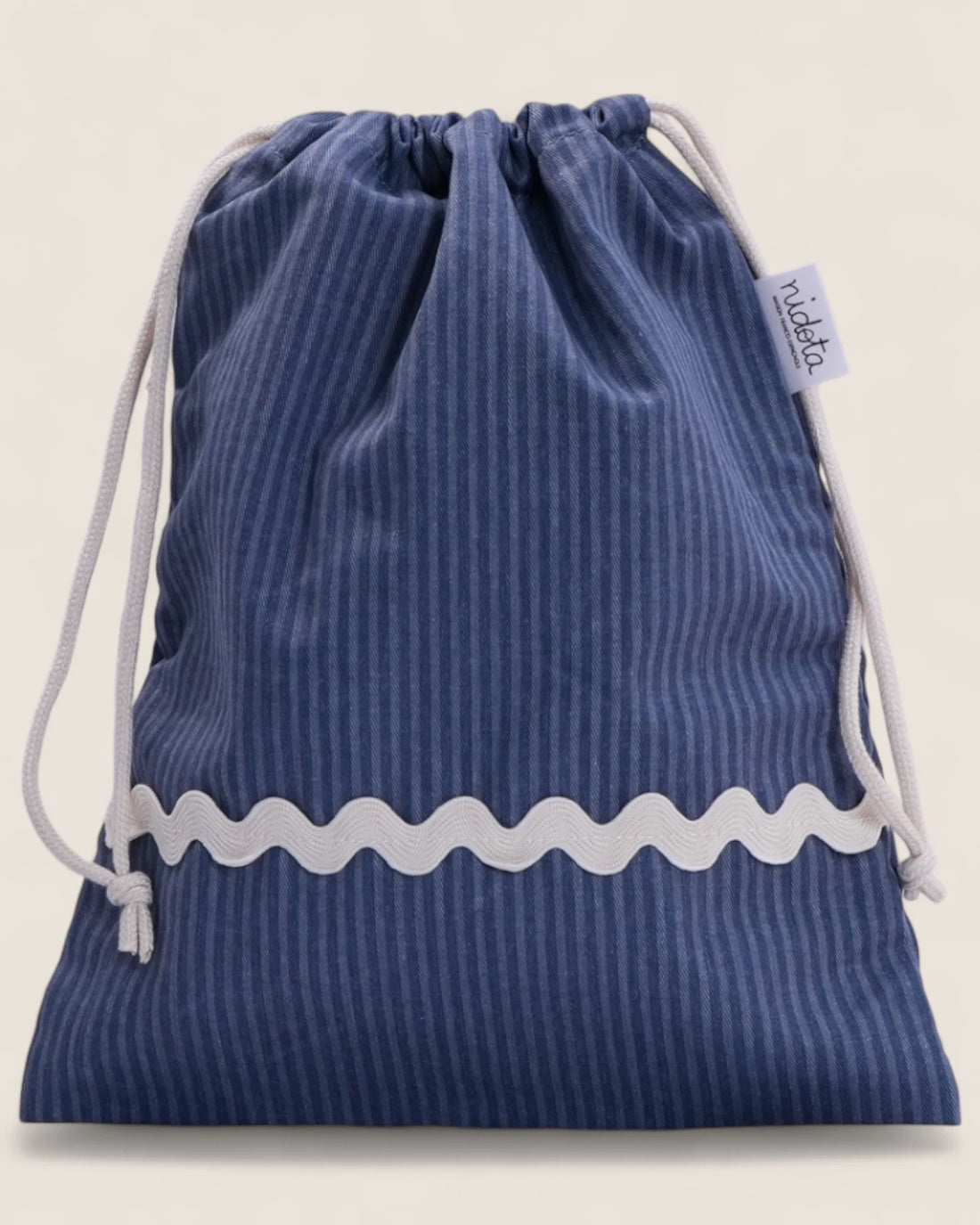 Blue striped pouch bag with white waved detail