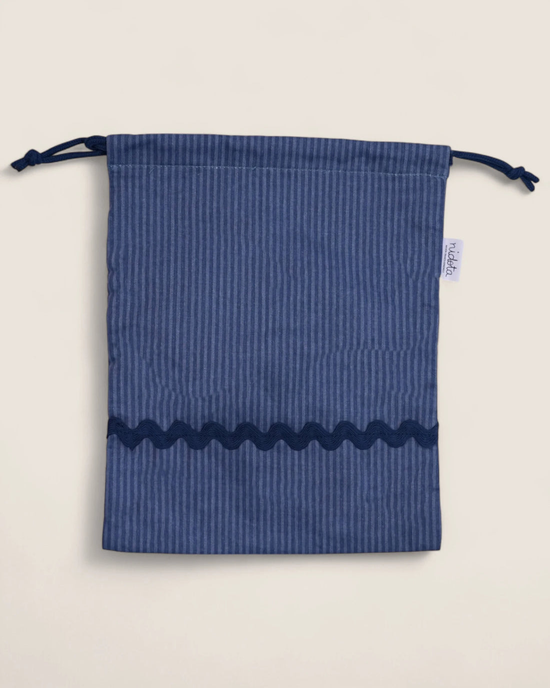 striped blue pouch bag with wavy navy design 
