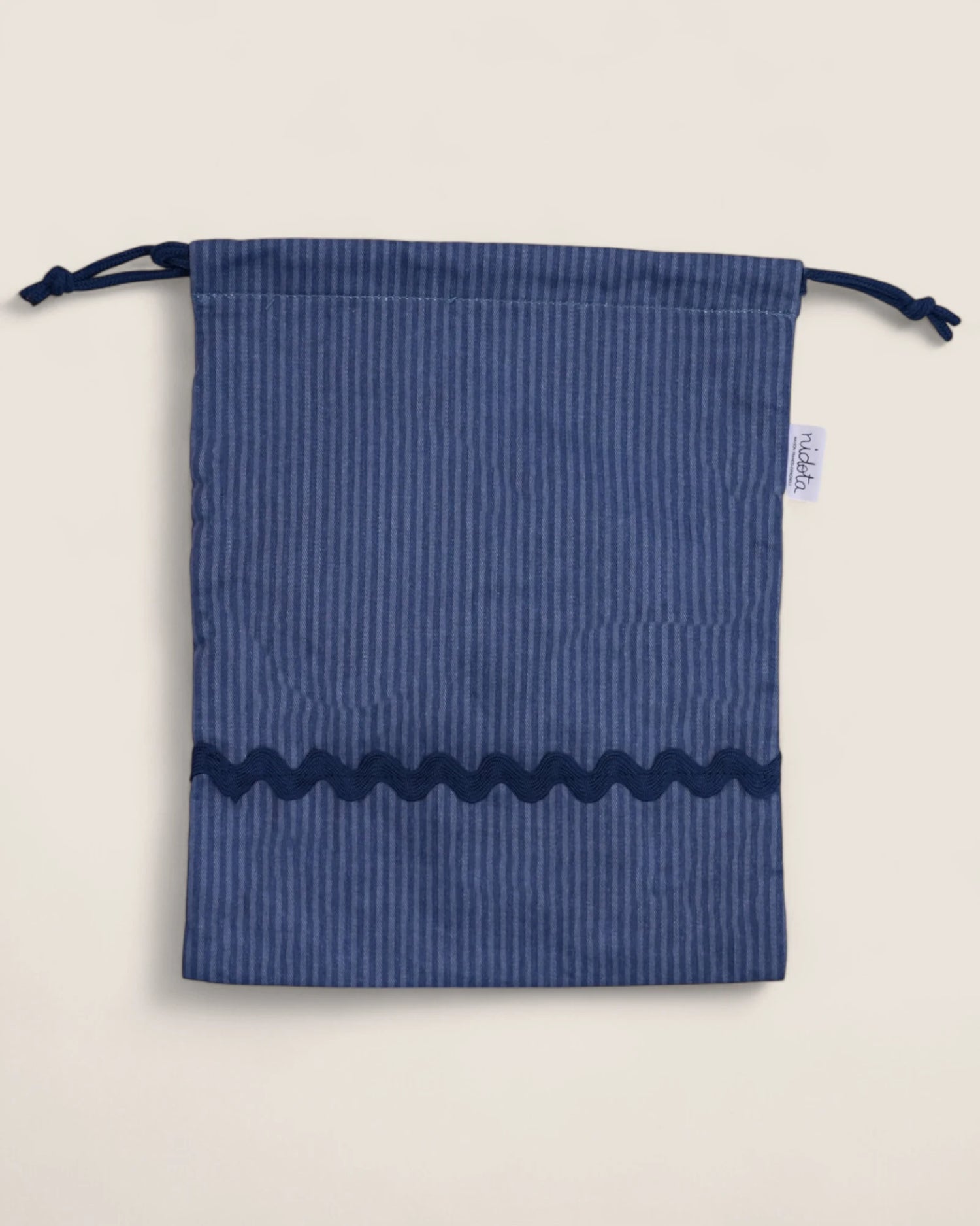 striped blue pouch bag with wavy navy design 
